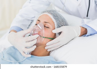 Young female patient receiving artificial ventilation in the hospital