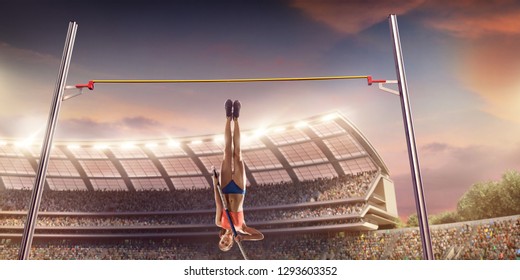 Young female pole vault athlete with pole bar. Women in sport clothes jump over the pole bar at athletic sport track in professional stadium - Powered by Shutterstock