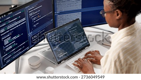 The Young Female Programmer Developing Software On Her Desktop Computer