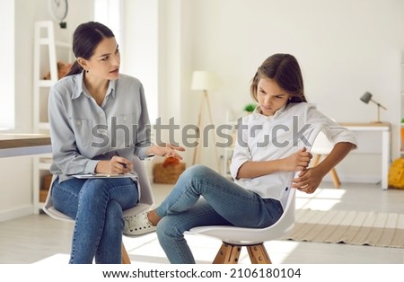 Young female psychologist talk with girl teenager suffering from bullying in school feeling depressed. Caring woman social worker have meeting with teen schoolgirl depression or adolescence crisis.
