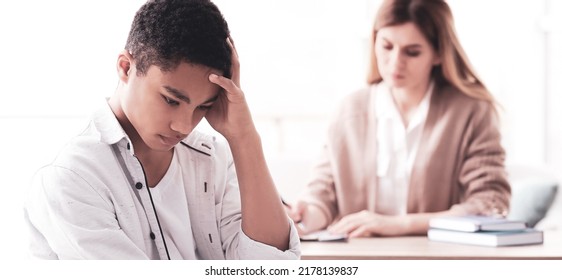 Young Female Psychologist Working With Teenage Boy In Office. Banner Design