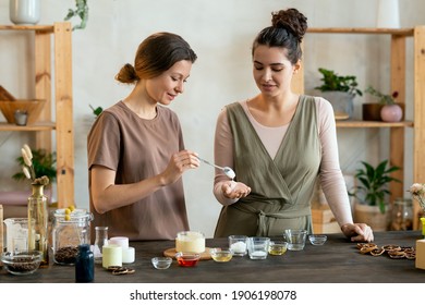 Young Female Putting Blob Of Fresh Handmade Liquid Soap Mass On Palm Of Her Friend Helping Her With Making Natural Handmade Cosmetic Products