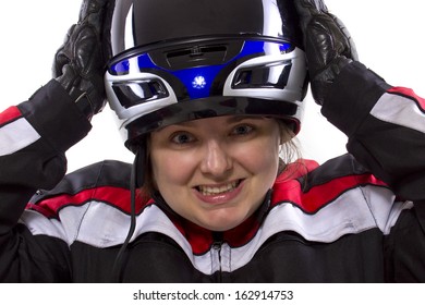 Young Female Race Car Driver In A Racing Suit And Helmet