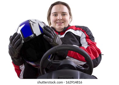 Young Female Race Car Driver In A Racing Suit And Helmet