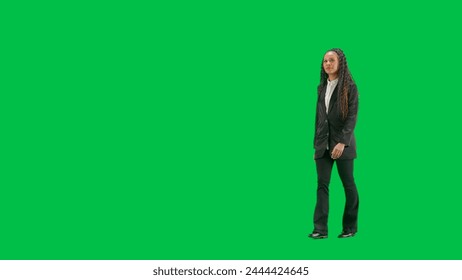 Young female reporter isolated on chroma key green screen background. Full shot african american woman tv news host walking. Half turn. - Powered by Shutterstock