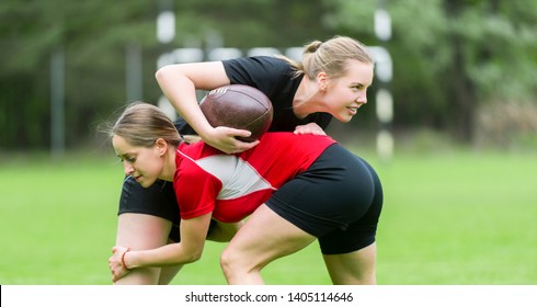 The young female rugby player on green backround - Powered by Shutterstock