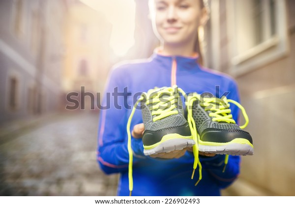 Young Female Runner Carrying Her 