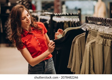 Young Female Sales Person At Sports Wear Shop