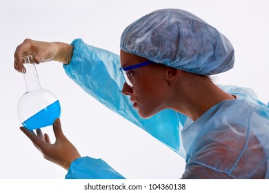 Young Female Scientist Looking At Fluid Specimen, Isolated Against White Background