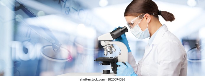 Young Female Scientist Standing With Medical Microscope