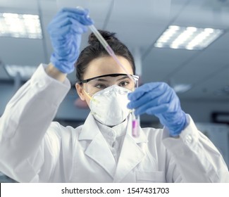 Young Female Scientist Working In The CDC Laboratory.