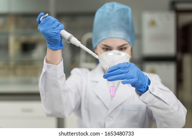 Young Female Scientist Working In The CDC Laboratory.