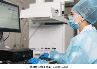 Young Female Scientist Working In The CDC Laboratory.