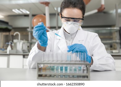 Young Female Scientist Working In The CDC Laboratory.