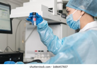 Young Female Scientist Working In The CDC Laboratory.