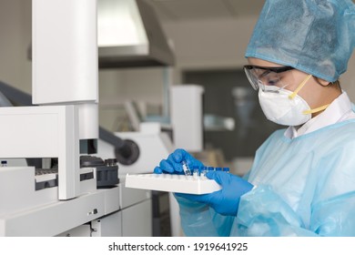 Young Female Scientist Working In The CDC Laboratory.