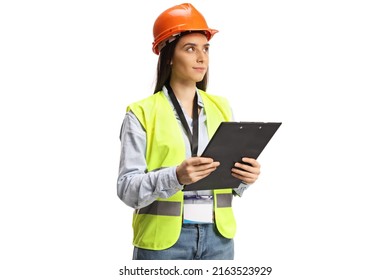 Young female site engineer with a safety vest and hardhat looking to the side isolated on white background - Powered by Shutterstock