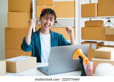 Young Female Small Business Entrepreneur, Online Business Startup Owner Woking On Laptop At Home Happy And Excited About Online Order Form Customers. Online Merketing, E-commerce Comept.