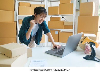 Young Female Small Business Entrepreneur, Online Business Startup Owner Woking On Laptop At Home Happy And Excited About Online Order Form Customers. Online Merketing, E-commerce Comept.