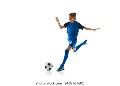 Young female soccer player in motion, teen girl practicing football, playing isolated on white studio background. Concept of sport, active and healthy lifestyle, childhood, school, hobby - Powered by Shutterstock