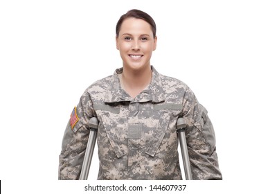 Young female soldier with crutches 
