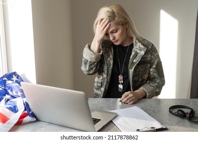 Young Female Soldier Working With Laptop In Headquarters Building.