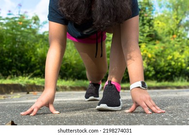 Young Female Sprinter Getting Ready To Start The Race. Teen Runner Getting Ready, Teen Running. Sports And Healthy Lifestyle Concept. 