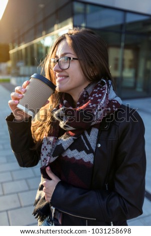 Young female student have coffee to go