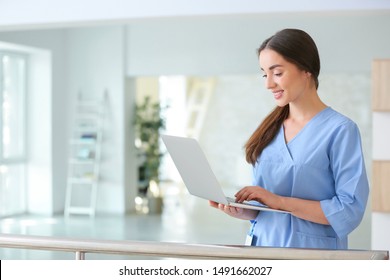 Young Female Student With Laptop In Clinic