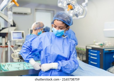 Young Female Surgeon Getting Ready To Operate