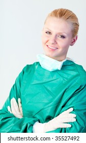 Young Female Surgeon With Her Mask Off Smiling At The Camera