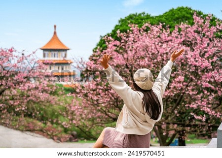 Similar – Image, Stock Photo Young woman enjoying cherry blossoms in springtime