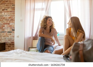 Young female tourists staying in youth hostel
