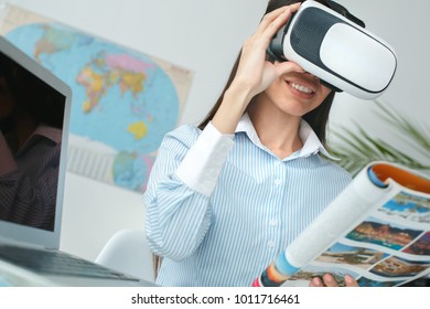 Young Female Travel Agent Consultant In Tour Agency Virtual Reality Headset