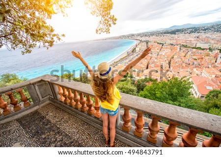 Young female traveler enjoying great view on the Nice city in France