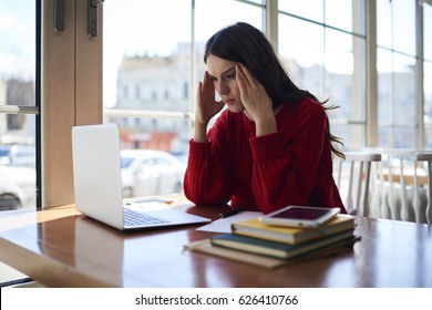 Young Female Upset Employee Having Headache Solving Problem With Startup Project Updating Application On Laptop Computer , Dissapointed Overworked Journalist Thinking About Advertising Comtent