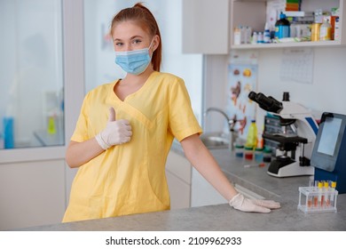 Young Female Veterinarian Standing In Veterinary Clinic