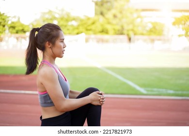 Young Female Warm Up Outdoor Morning Before Workout And Jogging At The Football Stadium With Sunbeam.