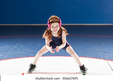 Young female wrestler in her stance