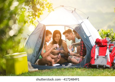 
young fiends have fun in tent on camping trip - Powered by Shutterstock