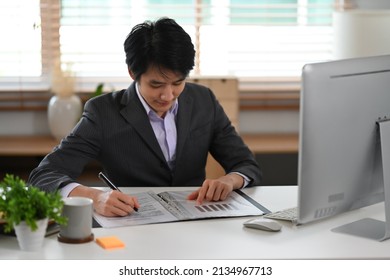 Young Finance Market Analyst Working With Computer At Bright Modern Workplace.