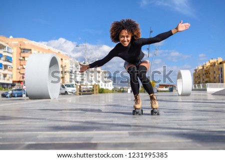 Similar – Young black woman doing stretching after running outdoors