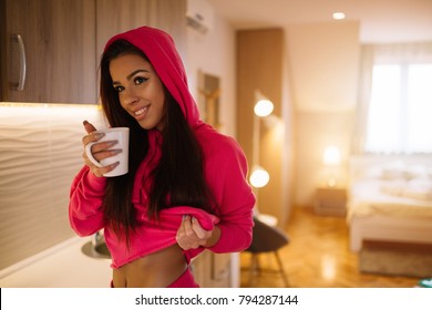 Young Fit Girl Drinking Coffee At Home Before Workout.