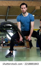 Young Fit Male Working Out In The Gym, Rope Strength Workout