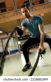 Young Fit Male Working Out In The Gym, Rope Strength Workout