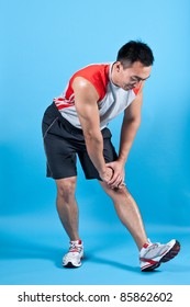 Young Fit Man Doing Hamstring Stretch