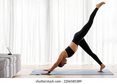 Young Fit Woman Doing Ashtanga Vinyasa Yoga Flow Sun Salutation At Home