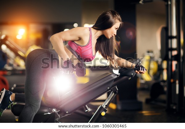 Young Fit Woman Doing Back Dumbbell Royalty Free Stock Image