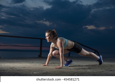 Young Fit Woman Doing Mountain Climber Exercise. Fitness Workout Outdoors