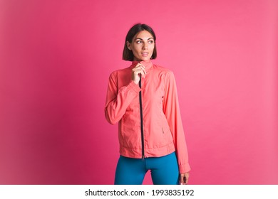 Young Fit Woman In Sport Wear Jacket On Pink Background